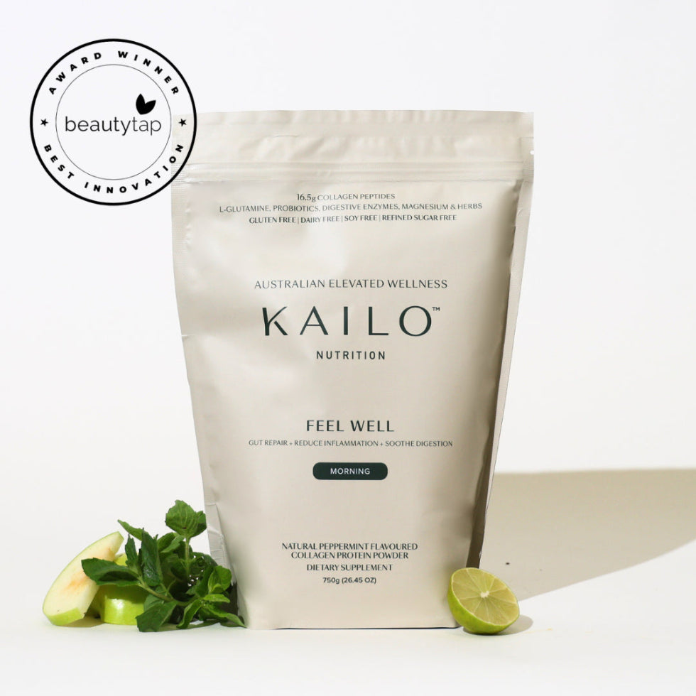 A packaged product labeled 'KAILO NUTRITION FEEL WELL GUT HEALTH COLLAGEN BLEND PEPPERMINT 750G' with a small amount of mint leaves and a slice of lime placed in front.