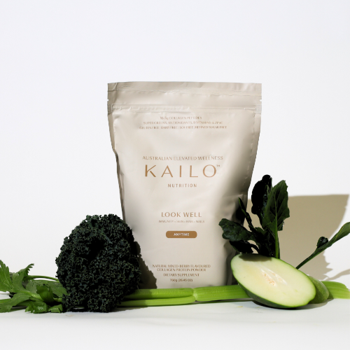 A package of KAILO Look Well collagen blend in Mixed Berry flavor, surrounded by various fruits and vegetables including mixed berries, bananas, and cucumbers.