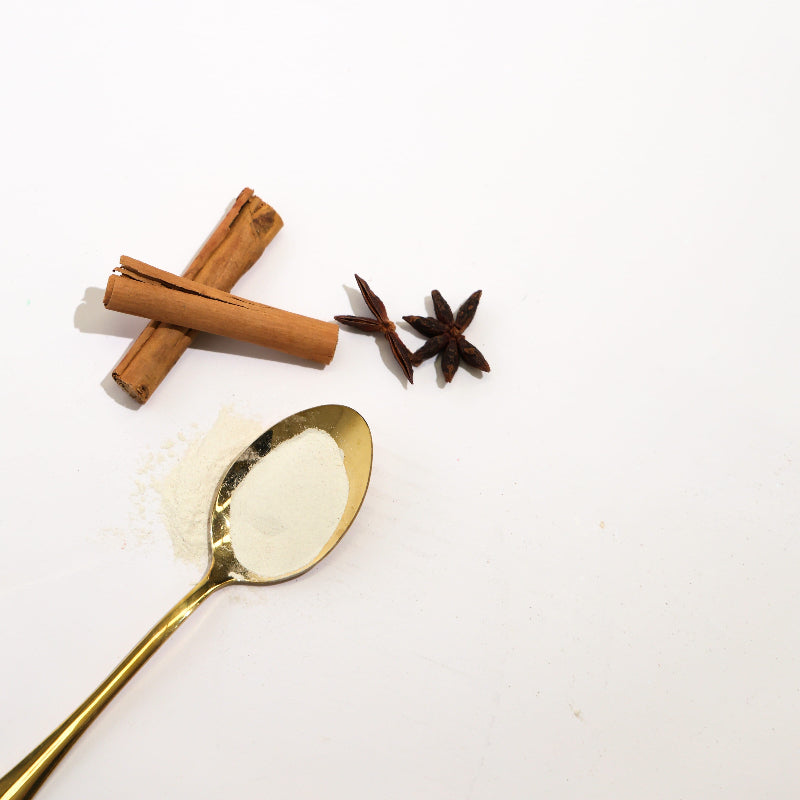 Plant Well powder in a golden spoon